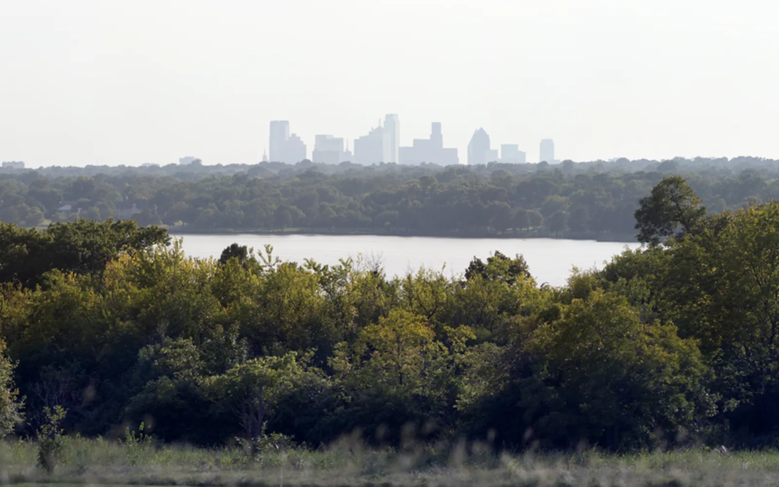 The Dallas skyline across White Rock Lake from Boy Scout Hill